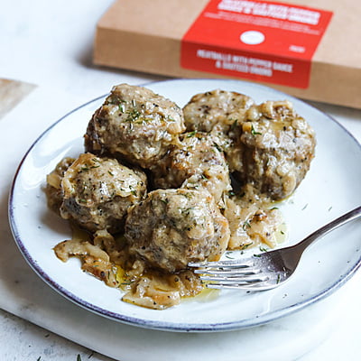 Meatballs With Pepper Sauce and Sauteed Onion